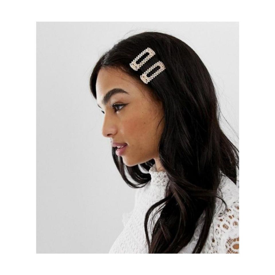 <strong><a href="https://us.asos.com/asos-design/asos-design-pack-of-2-hair-clips-in-square-shape-in-pearl/prd/11362445?clr=cream&amp;SearchQuery=hair%20clips&amp;gridcolumn=4&amp;gridrow=8&amp;gridsize=4&amp;pge=1&amp;pgesize=72&amp;totalstyles=52" target="_blank" rel="noopener noreferrer">Get the Asos square pearl hair clips for $9.50.</a></strong>