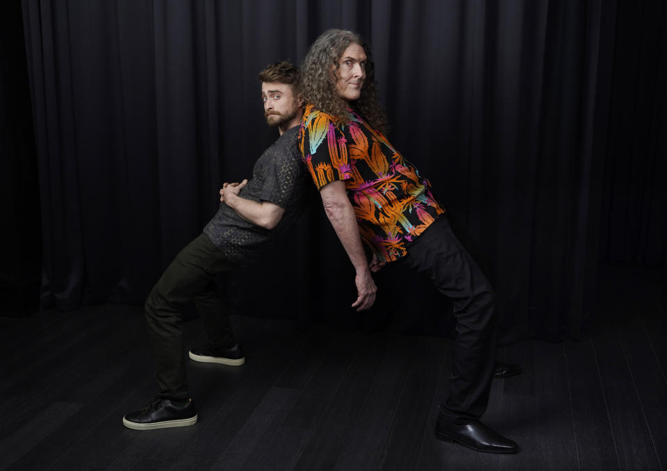 Daniel Radcliffe, left, and "Weird Al" Yankovic pose together for a portrait at the Bisha Hotel during the Toronto International Film Festival, Thursday, Sept. 8, 2022, in Toronto. Radcliffe plays Yankovich in the film "Weird: The Al Yankovic Story." (AP Photo/Chris Pizzello)