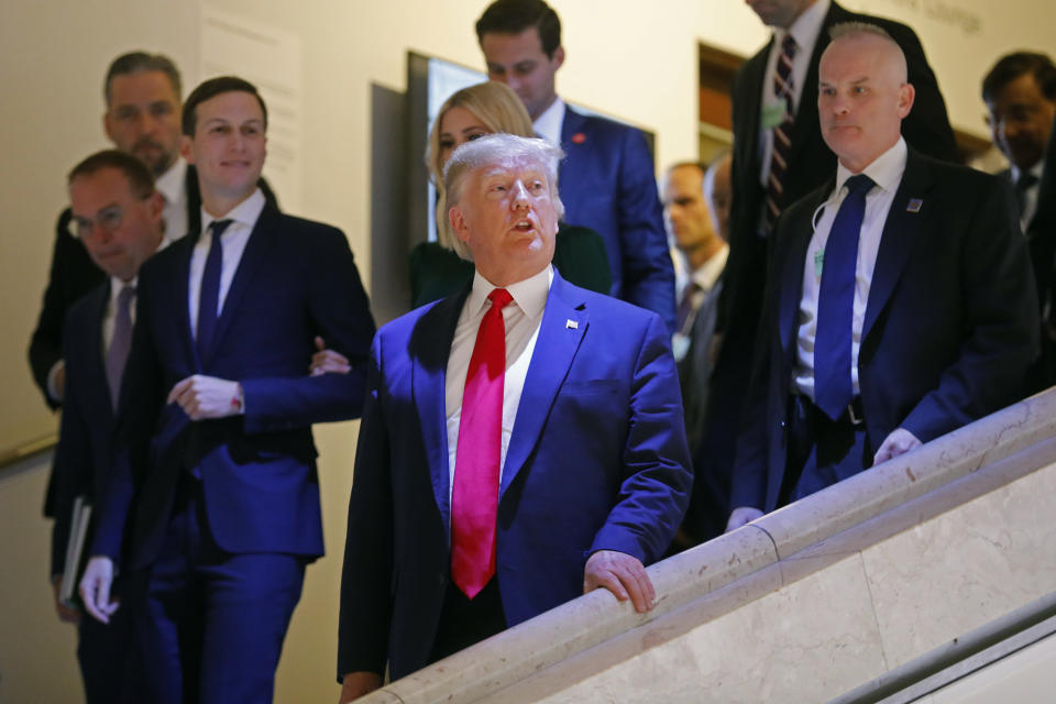 U.S. President Donald Trump, Jared Kushner, left, and Ivanka Trump, behind the President, leave the World Economic Forum in Davos, Switzerland, Tuesday, Jan. 21, 2020. The 50th annual meeting of the forum will take place in Davos from Jan. 21 until Jan. 24, 2020. (AP Photo/Markus Schreiber)