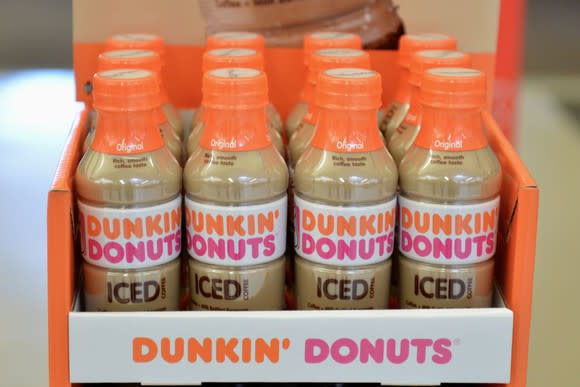 Bottles of Dunkin' Donuts iced coffee in a display.