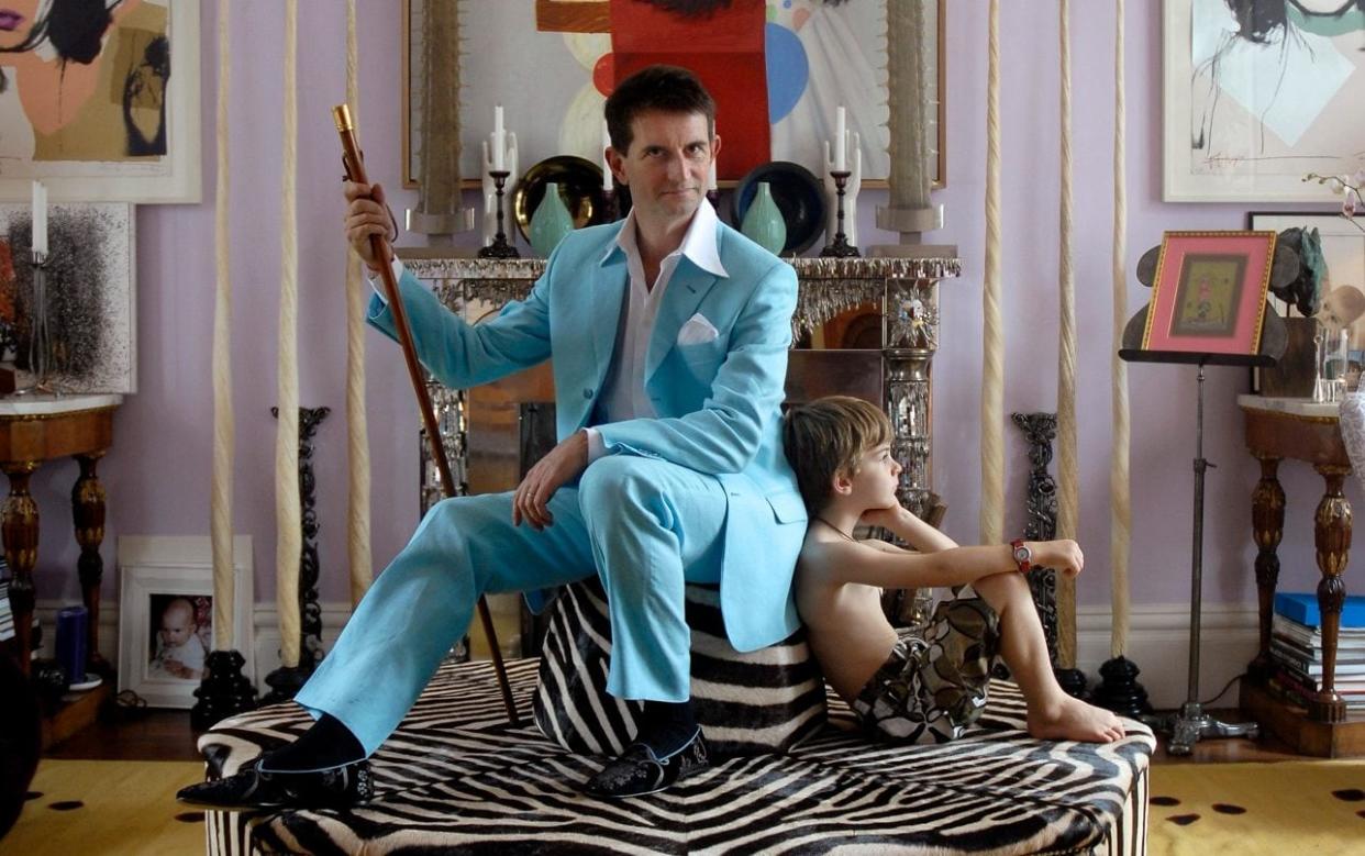 count manfredi and his son aliotto in a purple maximalist living room