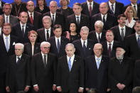 World leaders pose for a family photo during the World Holocaust Forum in Jerusalem, Thursday, Jan. 23, 2020. U.S. Vice President Mike Pence, Russian President Vladimir Putin, French President Emmanuel Macron, and the presidents of Germany, Italy and Austria were among the more than 40 dignitaries attending the World Holocaust Forum, which coincides with the 75th anniversary of the liberation of the Auschwitz death camp. (Abir Sultan/Pool Photo via AP)