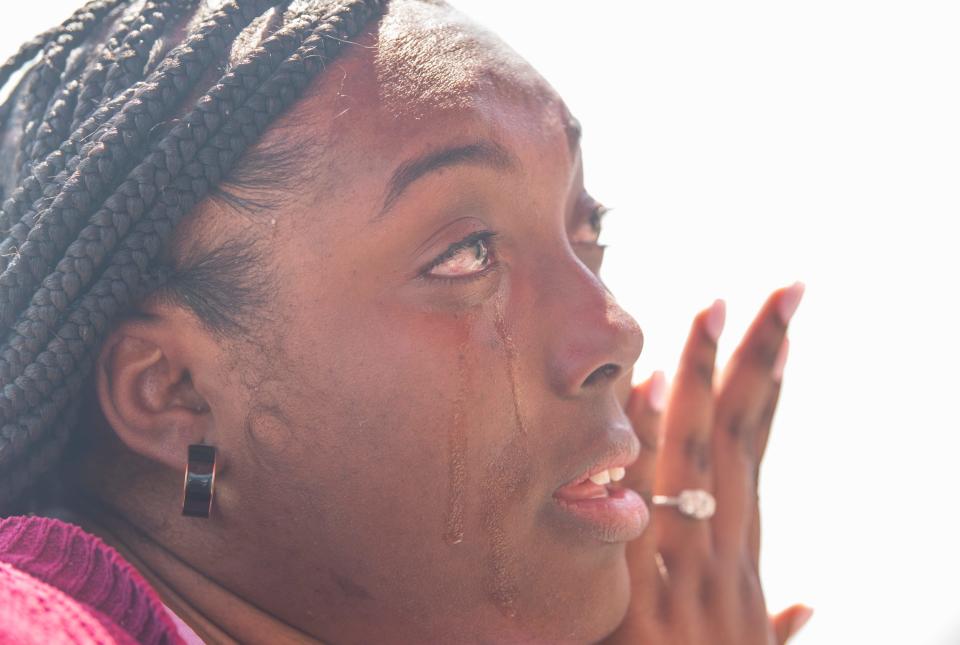 Raven Tolbert becomes emotional as she talks about the 2023 Dadeville shooting during an interview in Alexander City, Ala., on Monday, April 8, 2024.
