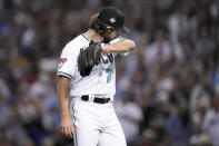 Arizona Diamondbacks starting pitcher Zac Gallen leaves the game against the Texas Rangers during the seventh inning in Game 5 of the baseball World Series Wednesday, Nov. 1, 2023, in Phoenix. (AP Photo/Godofredo A. Vásquez)