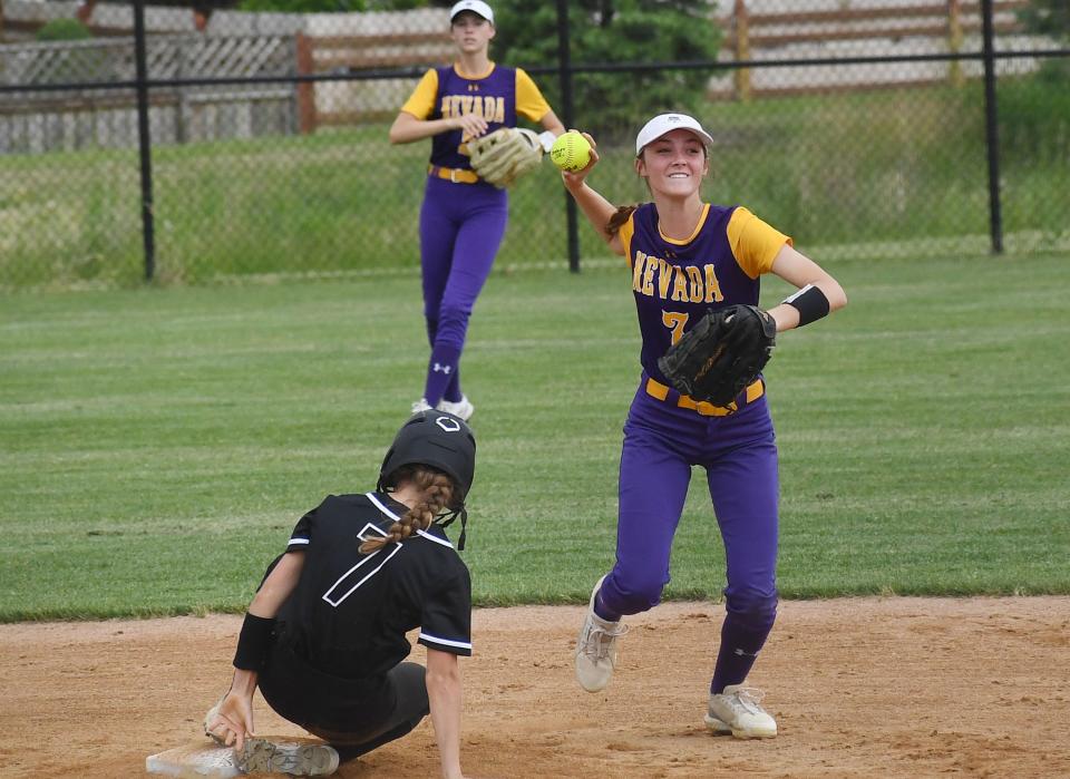 Nevada second baseman Briar Crain (7) aims to throws the ball to the first base after forcing out Ames' Meredith Frandsen (7) during the second inning of the Cubs' 12-0 loss to the No. 11 team in Class 5A at the Ames High Softball field Thursday, June 9, 2022, in Ames, Iowa.