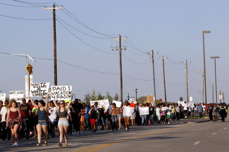 Protestors march during a rally against what demonstrators call police brutality in McKinney, Texas June 8, 2015. REUTERS/Mike Stone