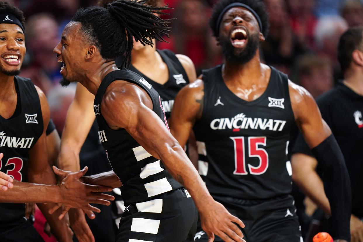 Cincinnati Bearcats guard Day Day Thomas (1) celebrates with John Newman III (15) and the team in UC's blowout win over Georgia Tech last Nov. 22.