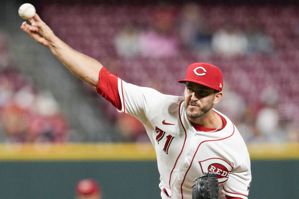 Cincinnati Reds relief pitcher Connor Overton (71) throws during the fifth inning of a baseball game against the Milwaukee Brewers, Saturday, Sept. 24, 2022, in Cincinnati. (AP Photo/Jeff Dean)