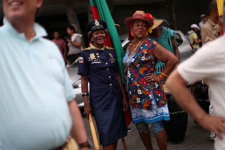 Members of a folk group take part in the celebration of Palmeros de Chacao, a Holy Week tradition, in Caracas, Venezuela, April 13, 2019. REUTERS/Ivan Alvarado