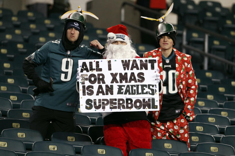 Philadelphia Eagles fans pose before a game against the Oakland Raiders on Christmas night. (AP)