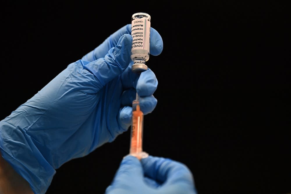 The Malaysian government has agreed to the administration of Covid-19 booster shots for high-risk groups after 80 per cent of the country’s population have been fully vaccinated. — AFP file pic