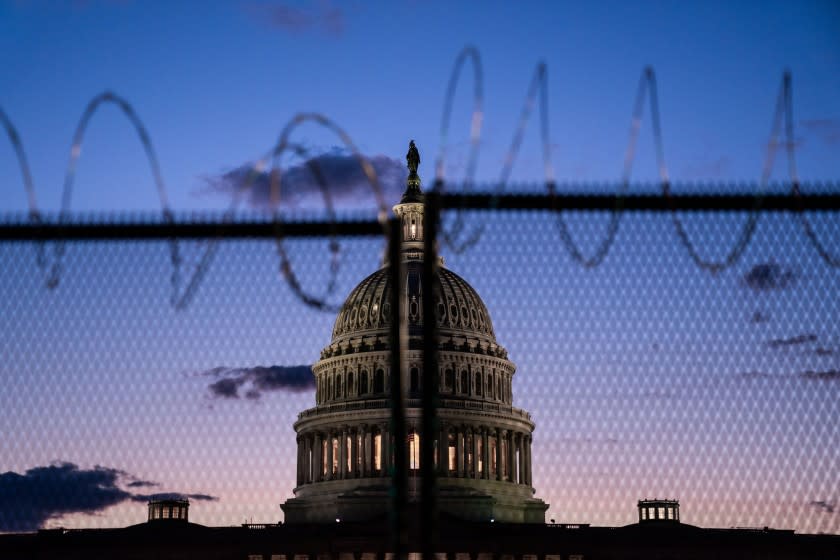 WASHINGTON, DC - MARCH 04: The U.S. Capitol Building, which saw boosted security, Thursday, after officials warned of an attack plot by extremists, two months after supporters of former president Donald Trump stormed the Capitol building is illuminated with the setting sun as the Senate debates the coronavirus relief package on Thursday, March 4, 2021 in Washington, DC. (Kent Nishimura / Los Angeles Times)