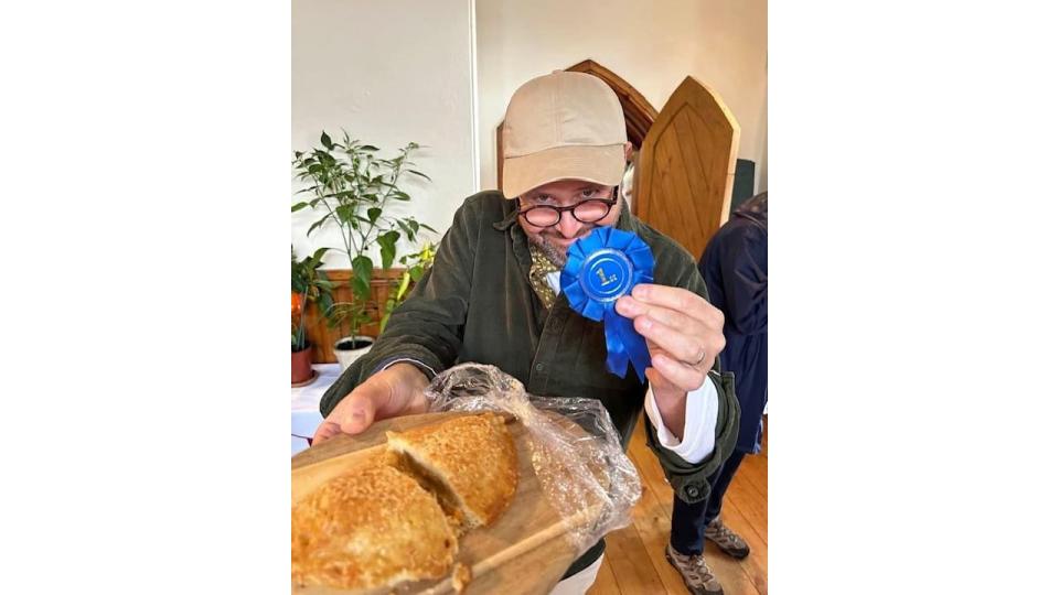 Jon Kay with his first-place rosette after winning a pasty bake off