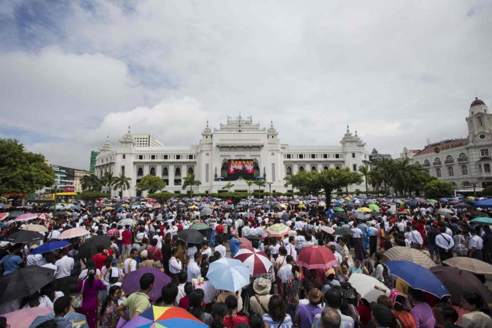 People gather to listen to the live speech of Aung San Suu Kyi (AFP/Getty Images)