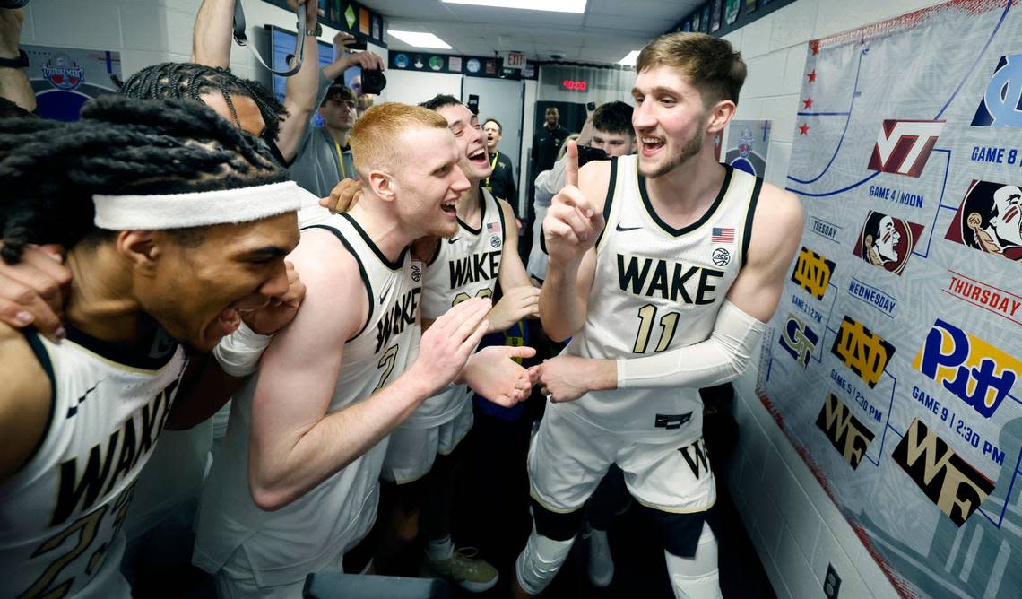 Wake Forest’s Andrew Carr (11) celebrates with teammates after placing the Wake Forest sticker on the board after beating Notre Dame in the second round of the 2024 ACC Men’s Basketball Tournament at Capital One Arena in Washington, D.C., Wednesday, March 13, 2024.