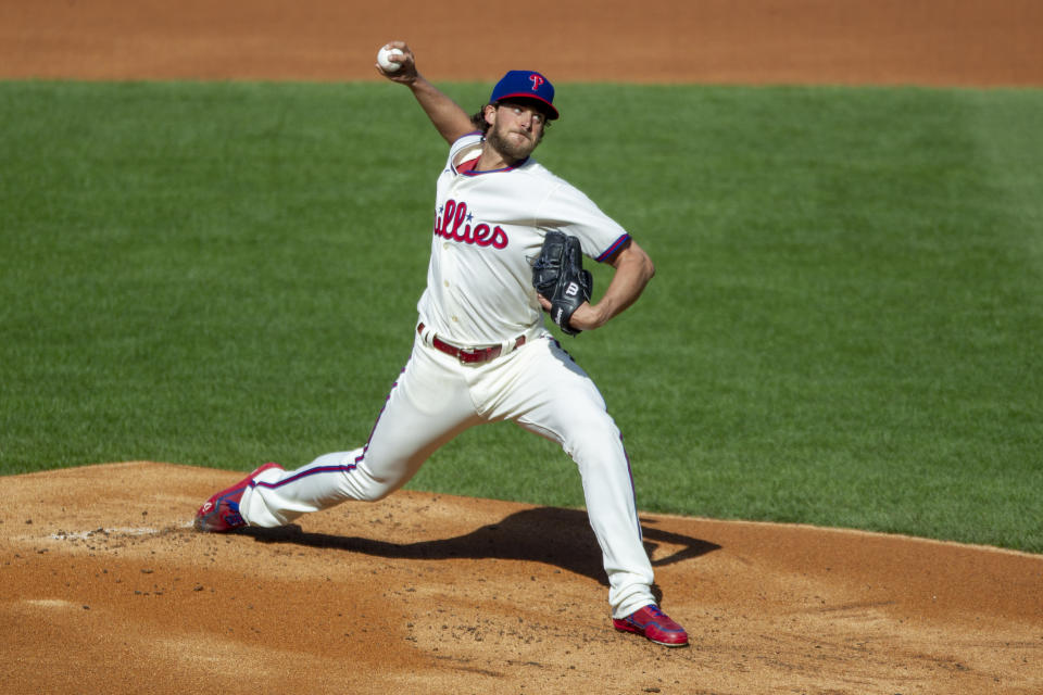 Philadelphia Phillies starting pitcher Aaron Nola (27) throws during the first inning of a baseball game against the New York Mets, Wednesday, April 7, 2021, in Philadelphia. (AP Photo/Laurence Kesterson)