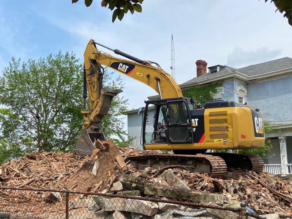 B&B Construction bid $46,000 to demolish four structures, including a house at 114 S. 13th St., where B&B worked Friday, May 20, 2022.