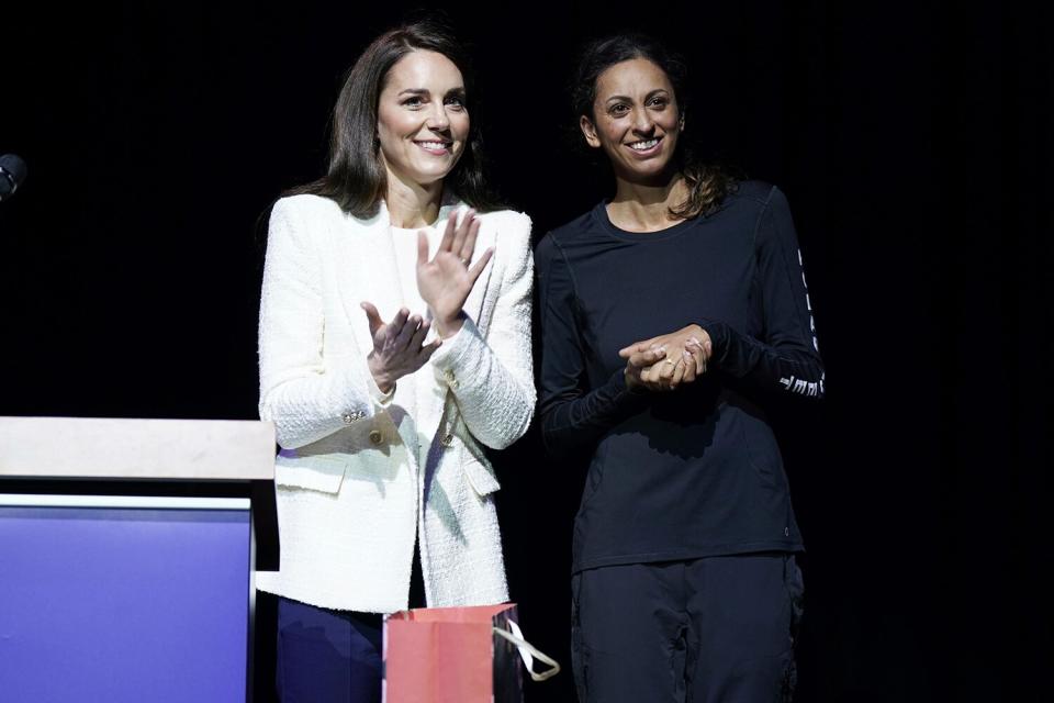 Kate, Princess of Wales, left, stands with Captain Preet Chandi, during a visit to Landau Forte College, in Derby, England, to celebrate Captain Chandi's return from her solo expedition across Antarctica