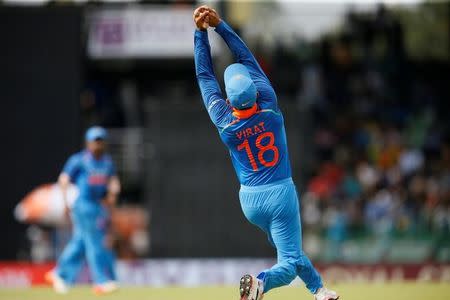 Cricket - Sri Lanka v India - Fifth One Day International Match - Colombo, Sri Lanka - September 3, 2017 - India's team captain Virat Kohli takes a catch to dismiss Sri Lanka's Dilshan Munaweera. REUTERS/Dinuka Liyanawatte/Files