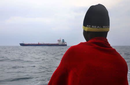 An African migrant in seen aboard the former fishing trawler Golfo Azzurro, following his rescue about thirty-two hours ago from a drifting dinghy by Spanish NGO Proactiva Open Arms, in the Mediterranean Sea, off the Libyan coast April 2, 2017. REUTERS/Yannis Behrakis