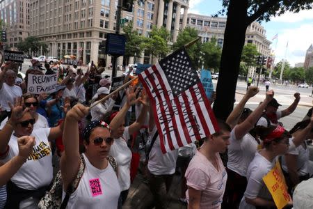 Immigration activists rally as part of a march calling for "an end to family detention" and in opposition to the immigration policies of the Trump administration, in Washington, U.S., June 28, 2018. REUTERS/Jonathan Ernst