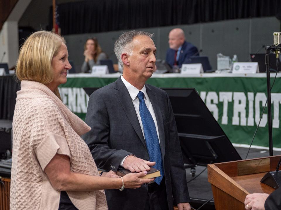 Pennridge School District board member Ron Wurz, right, is sworn in with his wife, Colleen, left, holding the bible during the Dec. 4, 2023, reorganization meeting. Wurz was later named board president of the newly Democrat-led Board of Directors.