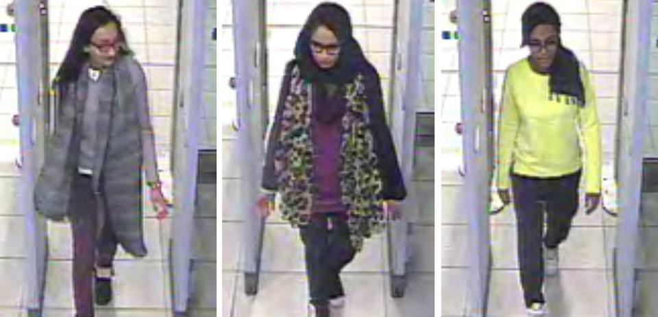 Kadiza Sultana, left, Shamima Begum, center, and Amira Abase going through security at Gatwick airport, south England, before catching their flight to Turkey (Metropolitan Police via AP)