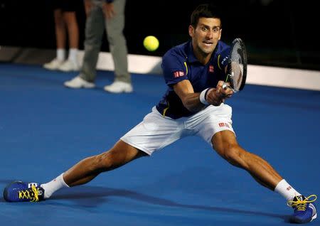 Serbia's Novak Djokovic hits a shot during his final match against Britain's Andy Murray at the Australian Open tennis tournament at Melbourne Park, Australia, January 31, 2016. REUTERS/Issei Kato