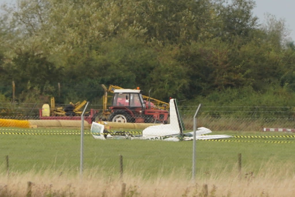 The wreckage of a light aircraft could be seen at Teesside Airport (Owen Humphreys/PA) (PA Wire)