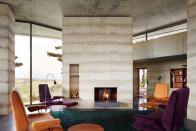 The main living space uses stone and concrete and has underfloor heating (Picture: Jack Hobhouse)