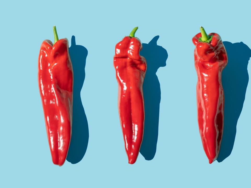 3 peppers on a blue background.