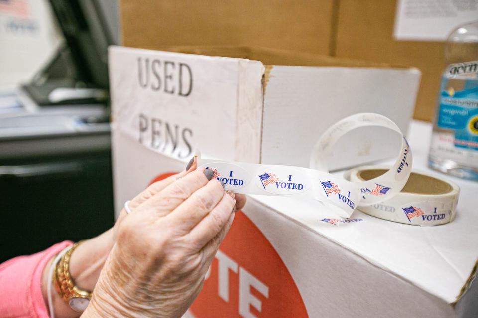 Hours after surgery, Susan Bennett and her husband David enter the polls to vote at the Oklahoma County Election Board for early voting on Thursday, March 31, 2022.