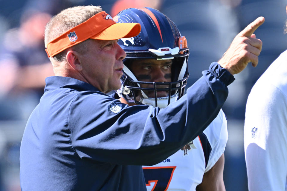 Oct 1, 2023; Chicago, Illinois, USA; Denver Broncos head coach Sean Payton talks with quarterback <a class="link " href="https://sports.yahoo.com/nfl/players/25785" data-i13n="sec:content-canvas;subsec:anchor_text;elm:context_link" data-ylk="slk:Russell Wilson;sec:content-canvas;subsec:anchor_text;elm:context_link;itc:0">Russell Wilson</a> (3) before a game against the <a class="link " href="https://sports.yahoo.com/nfl/teams/chicago/" data-i13n="sec:content-canvas;subsec:anchor_text;elm:context_link" data-ylk="slk:Chicago Bears;sec:content-canvas;subsec:anchor_text;elm:context_link;itc:0">Chicago Bears</a> at Soldier Field. Mandatory Credit: Jamie Sabau-USA TODAY Sports