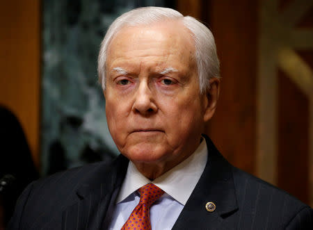 FILE PHOTO - Chairman of the Senate Finance Committee Orrin Hatch (R-UT) listens as Alex Azar II testifies on his nomination to be Health and Human Services secretary in Washington, U.S., January 9, 2018. REUTERS/Joshua Roberts