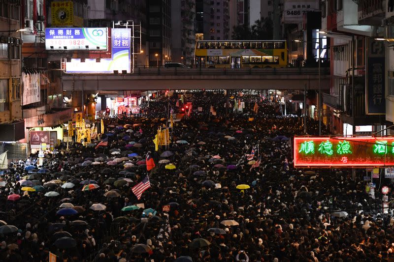 Protesters attend a Human Rights Day march in the district of Causeway Bay in Hong Kong