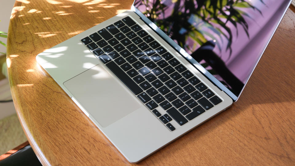 Apple MacBook Air close up of keyboard sitting on a wooden table