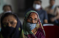 Elderly Indians wait to receive the COVID-19 vaccine at a private hospital in Gauhati, India, Thursday, March 4, 2021. The COVID-19 vaccination drive for senior citizens and those above 45 years of age with comorbidities began in government and designated private hospitals in Gujarat on Monday along with the rest of the country. (AP Photo/Anupam Nath)