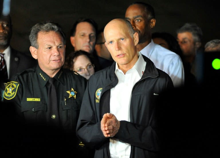 Florida Governor Rick Scott, seen speaking to the media after the mass shooting at Marjory Stoneman Douglas High School, puts off questions about gun control