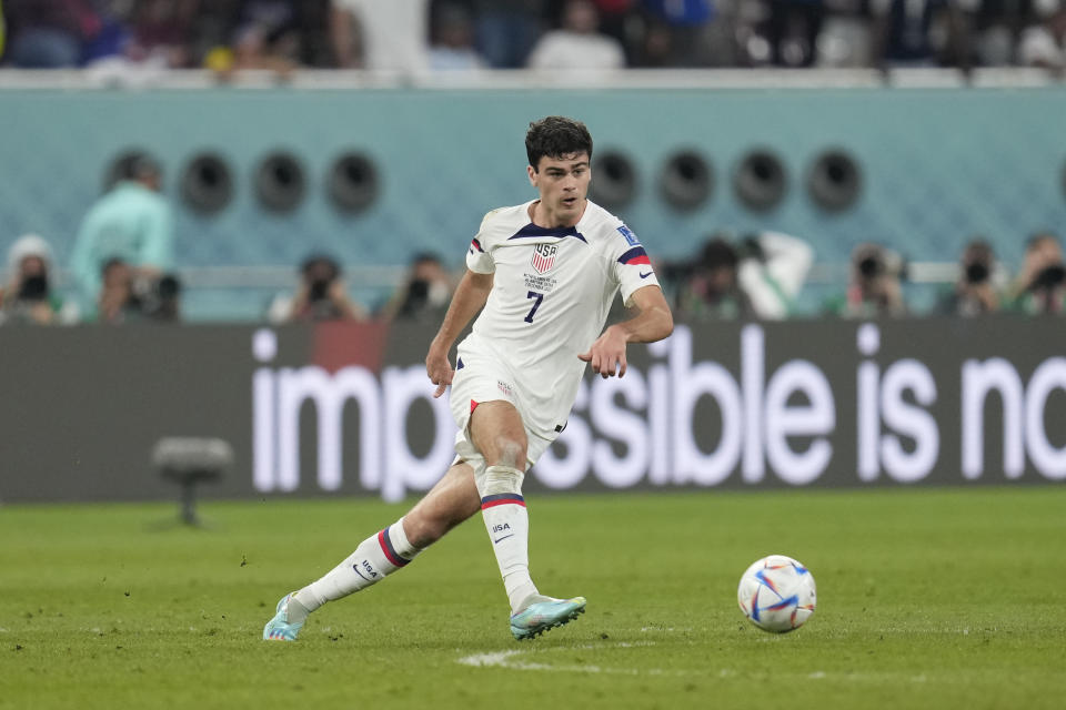 FILE - Gio Reyna of the United States kicks the ball during the World Cup round of 16 soccer match between the Netherlands and the United States, at the Khalifa International Stadium in Doha, Qatar, Saturday, Dec. 3, 2022. Former United States coach Jurgen Klinsmann says the fallout from the public dispute between coach Gregg Berhalter and the family of young star Reyna is “obviously not looking good” for U.S. soccer. Klinsmann, who coached the men’s national team from 2011-2016, said Wednesday, Jan. 18, 2023, he felt the problems between Berhalter and Reyna may have played a role in the team’s underwhelming performance at the World Cup in Qatar. (AP Photo/Natacha Pisarenko, File)