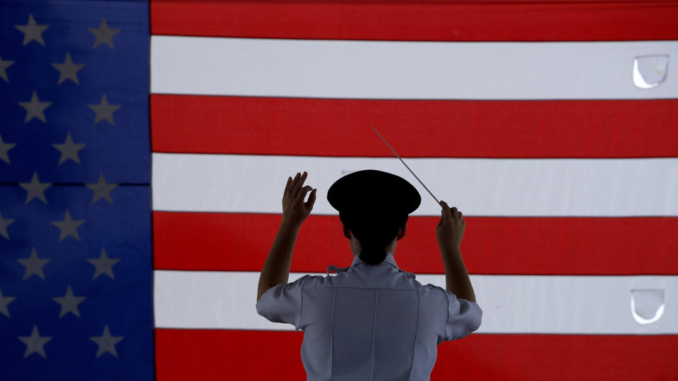 <p>Conductor Heather Pickett directs the band during an Independence Day concert by the American Legion Band of Greater Kansas City Wednesday, July 4, 2018, in Merriam, Kan. (Photo: Charlie Riedel/AP) </p>