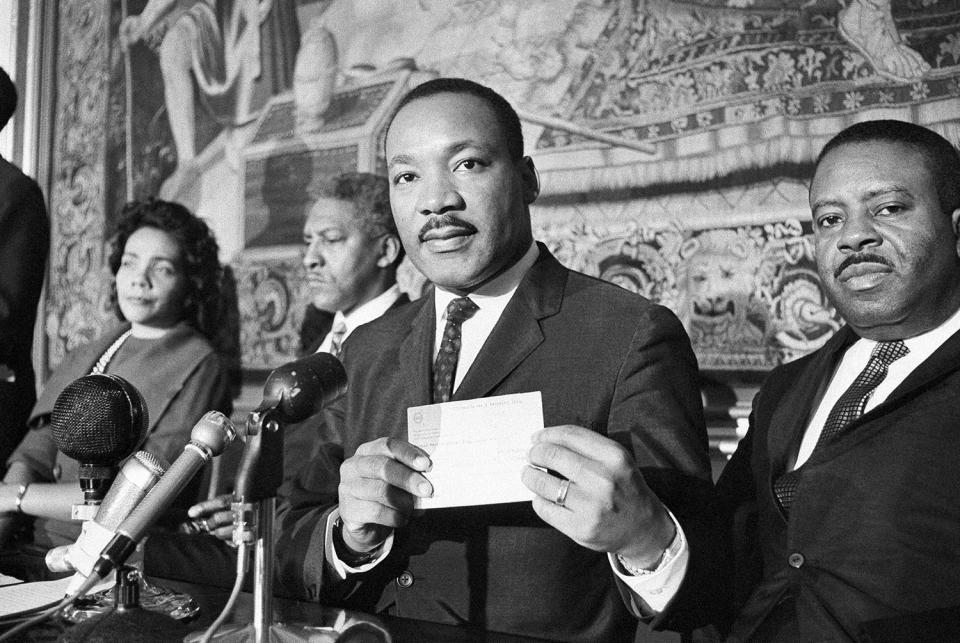 <p>Martin Luther King with the check for 273,000 Swedish crownes in Norway, Dec. 11, 1964. (AP Photo) </p>