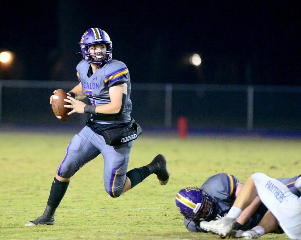 Escalon quarterback Donovan Rozevink (7) scrambles out of the pocket during a 2023 CIF San Joaquin Section Division IV football game between Escalon and West Park at Escalon High School in Escalon California on November 17, 2023. Escalon won the game 48-28.