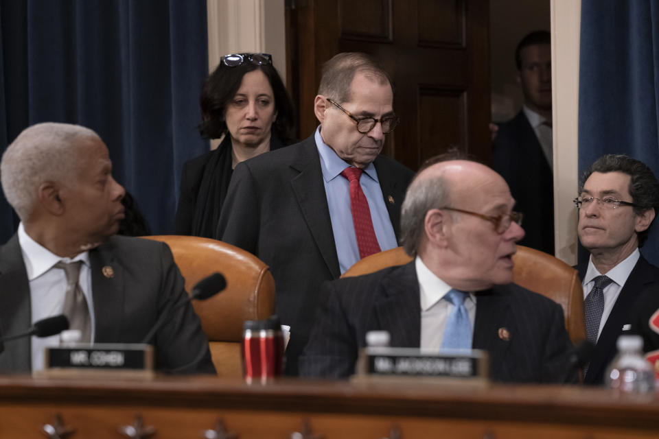 House Judiciary Committee Chairman Jerrold Nadler, D-N.Y., flanked by Rep. Hank Johnson, D-Ga., left, and Rep. Steve Cohen, D-Tenn., right, arrives to lead the vote on two articles of impeachment against President Donald Trump, Friday, Dec. 13, 2019, on Capitol Hill in Washington. (AP Photo/J. Scott Applewhite)