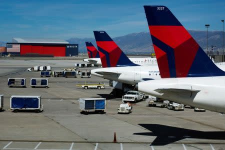 FILE PHOTO: Delta planes line up at their gates while on the tarmac of Salt Lake City International Airport in Utah September 28, 2013. REUTERS/Lucas Jackson/File Photo