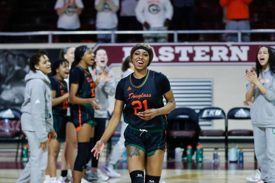 Frederick Douglass’ Ayanna-Sarai Darrington smiles during player introductions before the 11th Region Tournament championship game at Eastern Kentucky University’s Baptist Health Arena in Richmond on March 4.
