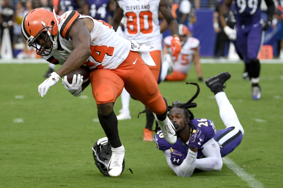 FILE - In this Sept. 29, 2019, file photo, Cleveland Browns running back Nick Chubb (24) avoids a tackle by Baltimore Ravens cornerback Maurice Canady (26) while running for a touchdown during the second half of an NFL football game in Baltimore. The Browns were pegged (hyped?) to be a budding powerhouse with all of the improvements in talent. Instead, they are perhaps the most inconsistent team in the league. (AP Photo/Nick Wass, File)