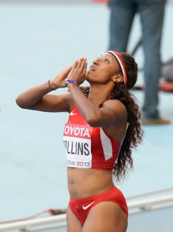 American Brianna Rollins celebrates after winning the women's 100 metres hurdles final at the 2013 IAAF World Championships at the Luzhniki stadium in Moscow on August 17, 2013