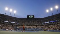 Novak Djokovic of Serbia serves to Rafael Nadal of Spain during their men's final match at the U.S. Open tennis championships in New York, September 9, 2013. REUTERS/Ray Stubblebine (UNITED STATES - Tags: SPORT TENNIS)