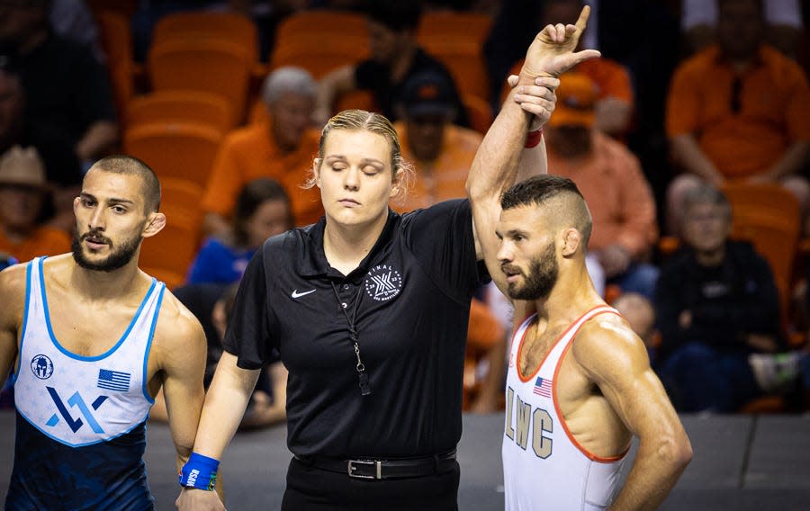 Thomas Gilman, right, defeated Vito Arujau by 12-2 technical fall at Final X in Stillwater on Friday. Gilman was an All-American wrestler for Iowa.
