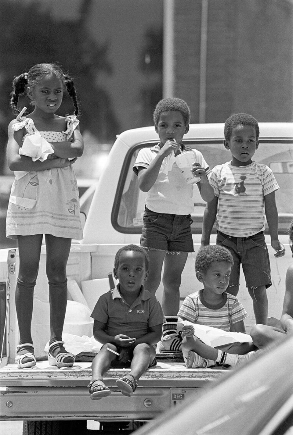 Attendees of Juneteenth parade festivities in Fort Worth; 1983-06-18 [FWST photographer Ron T. Ennis]